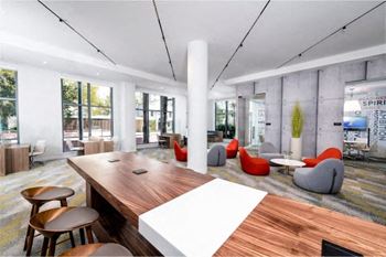 A large room with a wooden table and chairs